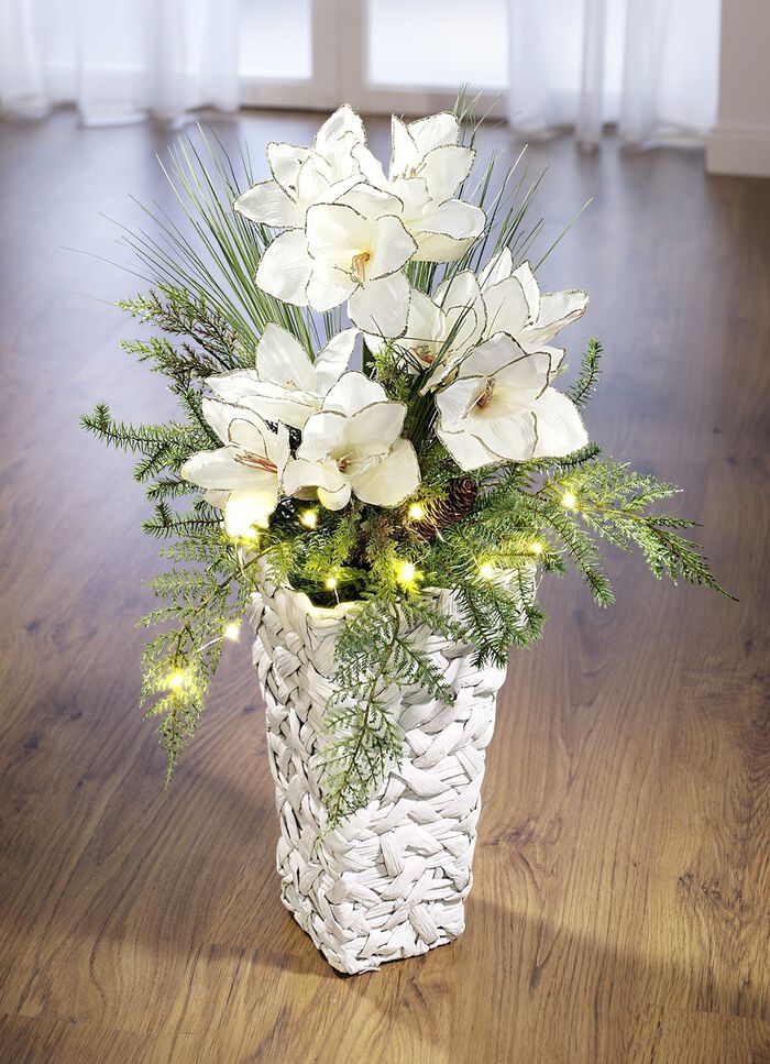Beleuchtetes Amaryllis-Gesteck in Vase 